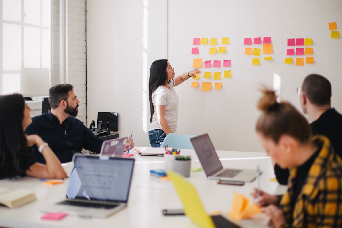 Strategy roundtable with marketing agency team reviewing brand narrative documents